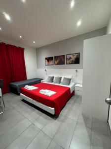 A bed or beds in a room at Affittacamere Sikelia