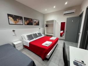A bed or beds in a room at Affittacamere Sikelia