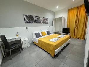 A bed or beds in a room at Affittacamere Sikelia