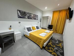 A bed or beds in a room at Affittacamere Sikelia