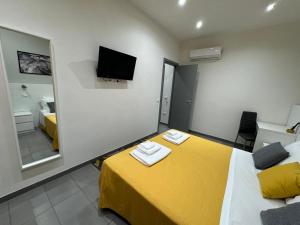 A bed or beds in a room at Affittacamere Sikelia