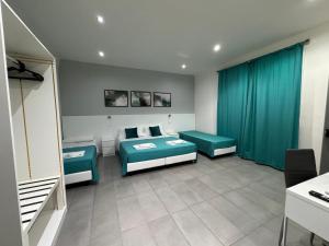 A bed or beds in a room at Affittacamere Sikelia