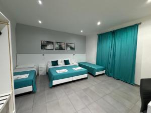 A bed or beds in a room at Affittacamere Sikelia