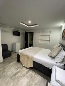 Voodi või voodid majutusasutuse Hotel Plaza Norte Cali toas