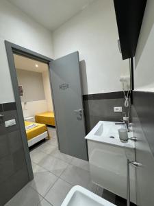 A bed or beds in a room at Affittacamere Sikelia