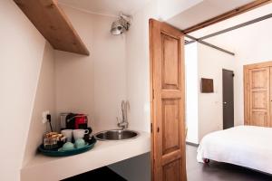 Voodi või voodid majutusasutuse Palazzo Biancofiore, suites & rooftop toas