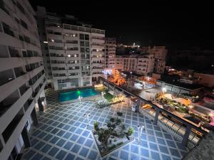 an overhead view of a city at night at Family apartment NZ in Tangier