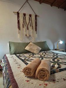 Letto o letti in una camera di Casa Amaru