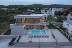 an aerial view of a house with a swimming pool at Villa La Casa in Bibinje