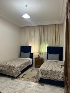 Ένα ή περισσότερα κρεβάτια σε δωμάτιο στο Tadart luxery hoom