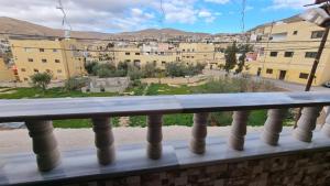 a view of a city from a balcony at City centre Apartment in Petra