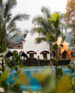 a white building with a sign in front of it at Comarca del Hobit in Yala