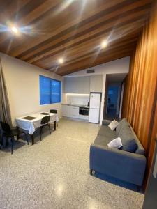 a living room with a couch and a table at Roys View in Wanaka