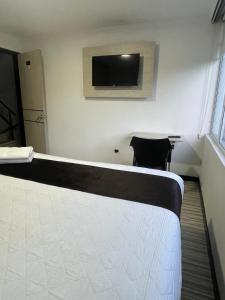 TV a/nebo společenská místnost v ubytování Hotel AMBAR KING