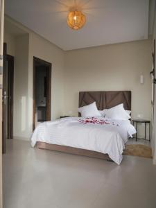 Kama o mga kama sa kuwarto sa Appartement vue océan