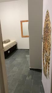 a room with a door with a picture of a leopard at Hotel Pantanal in Cuiabá
