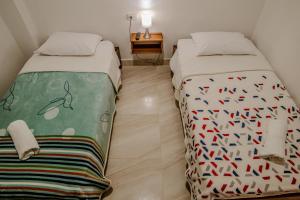 Cama o camas de una habitación en Apartahotel La Gruta