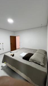 Postel nebo postele na pokoji v ubytování Casa Ampla com Piscina e Área de Churrasco 400A