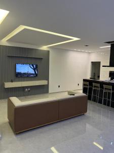 TV a/nebo společenská místnost v ubytování Casa Ampla com Piscina e Área de Churrasco 400A