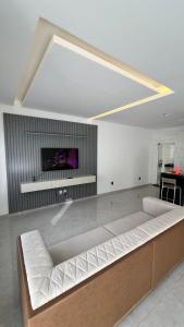 TV a/nebo společenská místnost v ubytování Casa Ampla com Piscina e Área de Churrasco 400A