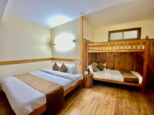 Postelja oz. postelje v sobi nastanitve The Vashisht, Manali - A Four Star Luxury Hotel