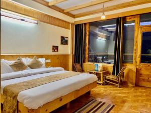 Postelja oz. postelje v sobi nastanitve The Vashisht, Manali - A Four Star Luxury Hotel