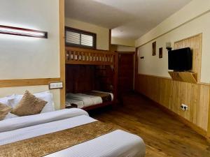 Postelja oz. postelje v sobi nastanitve The Vashisht, Manali - A Four Star Luxury Hotel