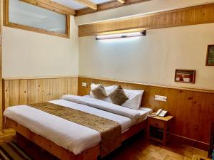 Postelja oz. postelje v sobi nastanitve The Vashisht, Manali - A Four Star Luxury Hotel