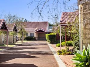 a street in a residential neighborhood with houses at Clearwater Escape Dunsborough in Dunsborough