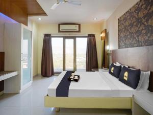 Postel nebo postele na pokoji v ubytování Hotel Tela Suite Near IGI Airport Delhi