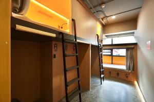 Palanda nebo palandy na pokoji v ubytování Wohkoon者行孙青年酒店北京南站店