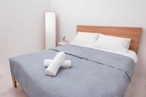 Voodi või voodid majutusasutuse Taiping Homestay 5R3B, 9mins - Zoo & Lake Garden Taiping toas