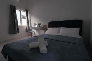 Voodi või voodid majutusasutuse Taiping Homestay 5R3B, 9mins - Zoo & Lake Garden Taiping toas
