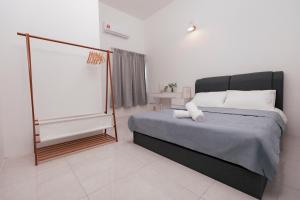 Voodi või voodid majutusasutuse Taiping Homestay 5R3B, 9mins - Zoo & Lake Garden Taiping toas