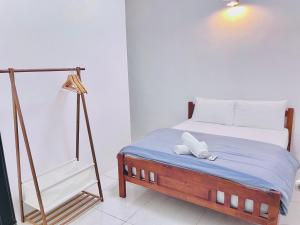Voodi või voodid majutusasutuse Taiping Homestay 5R3B, 9mins - Zoo & Lake Garden Taiping toas