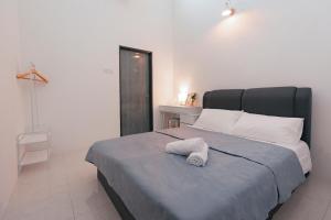 Voodi või voodid majutusasutuse Taiping Homestay 5R3B, 9mins - Zoo & Lake Garden Taiping toas
