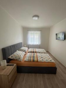 Postel nebo postele na pokoji v ubytování Apartmány Ferie