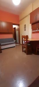 an empty room with a table and a bed at Karya House in Kariá +18 photos