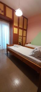a bedroom with a large bed in a room at Karya House in Kariá