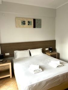 Posteľ alebo postele v izbe v ubytovaní Eleonas Apartments