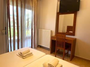 Posteľ alebo postele v izbe v ubytovaní Eleonas Apartments