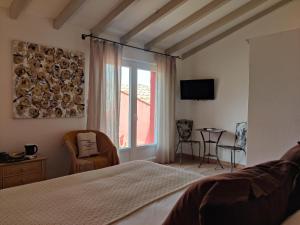 Postel nebo postele na pokoji v ubytování Le Roc E Fiori Hotel - Teritoria