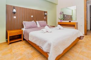 Postel nebo postele na pokoji v ubytování Villas Duc - Rhodes