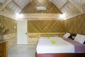 A bed or beds in a room at Aranka Tempasan