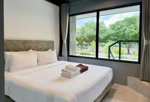 Voodi või voodid majutusasutuse Midtown Sukhothai toas +37 fotot