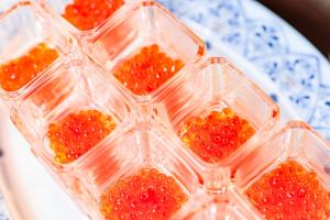 four plastic containers filled with fruit on a plate at Hotel Torifito Otaru Canal in Otaru