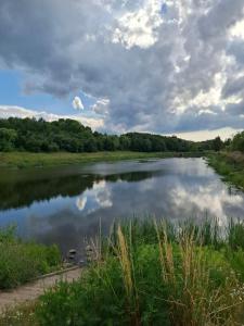 a view of a river with clouds in the sky at Przytulny 2-pokojowy apartament na wakacje w Gdańsku in Gdańsk