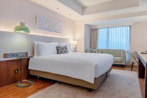 Ένα ή περισσότερα κρεβάτια σε δωμάτιο στο Kilin Hotel, JiaoXi