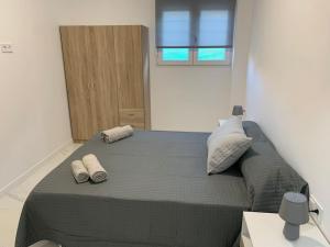 Ένα ή περισσότερα κρεβάτια σε δωμάτιο στο Apartamento Sara - Alquiler de temporada