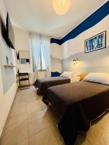 Postel nebo postele na pokoji v ubytování ZAPPI CYCLING HOTEL
